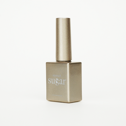 Bottle of glitter gold gel nail polish from Skynailbysugar